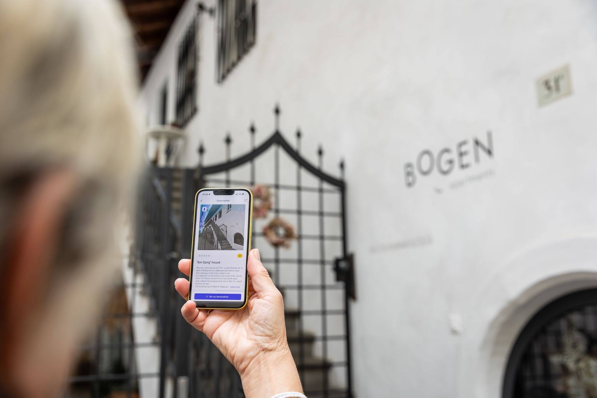 User viewing Stendhapp in a city setting, showing how reliable Open Data Hub datasets support tourism app development.