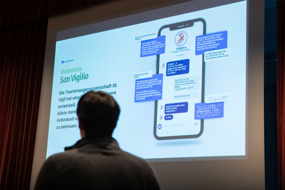 Photo of a TOURISTINFO.AI presentation using San Vigilio di Marebbe as an example to demonstrate the chatbot for sustainable tourism services.